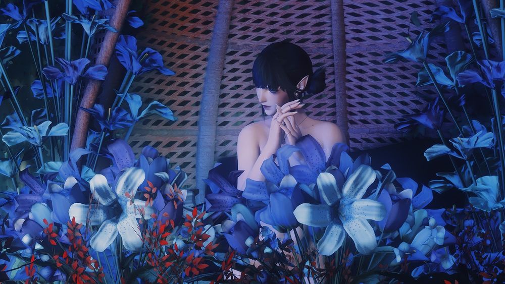 Marielle, an elf OC, sits surrounded by blue and red flowers. She appears naked with her face tilted away, hiding her expression. Her hands, adorned with rings, are clapsed together near her face.