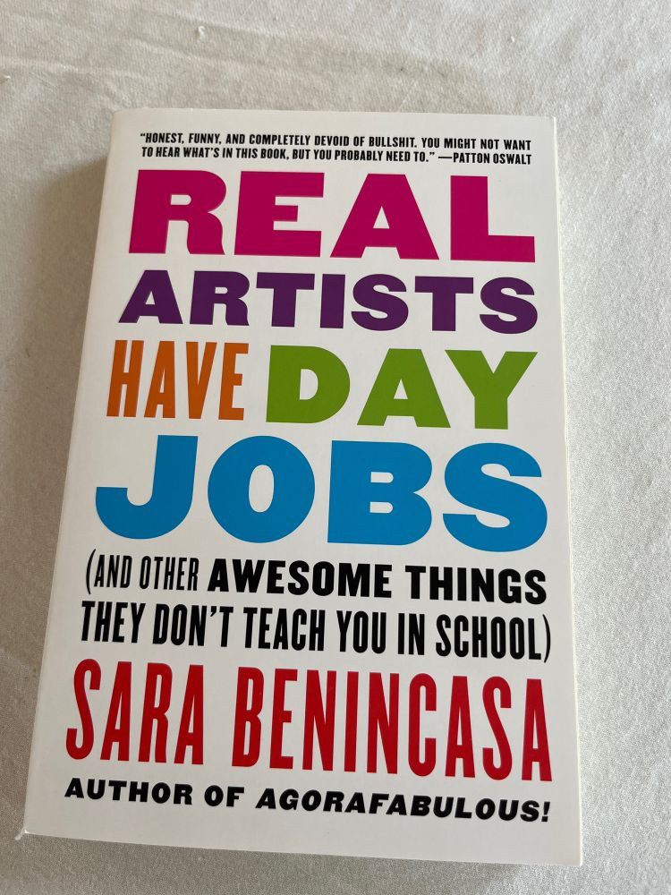 Photo of Sara Benincasa’s book, REAL ARTISTS HAVE DAY JOBS. 