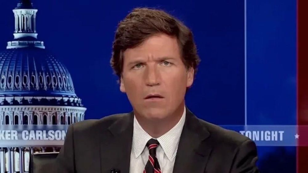 tucker carlson looking confused at the camera
