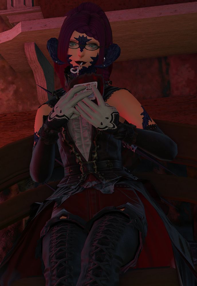 Rose A'kan sitting on a bench, cheerfully sipping from a blood bag with a straw. She is looking cutely at the camera.