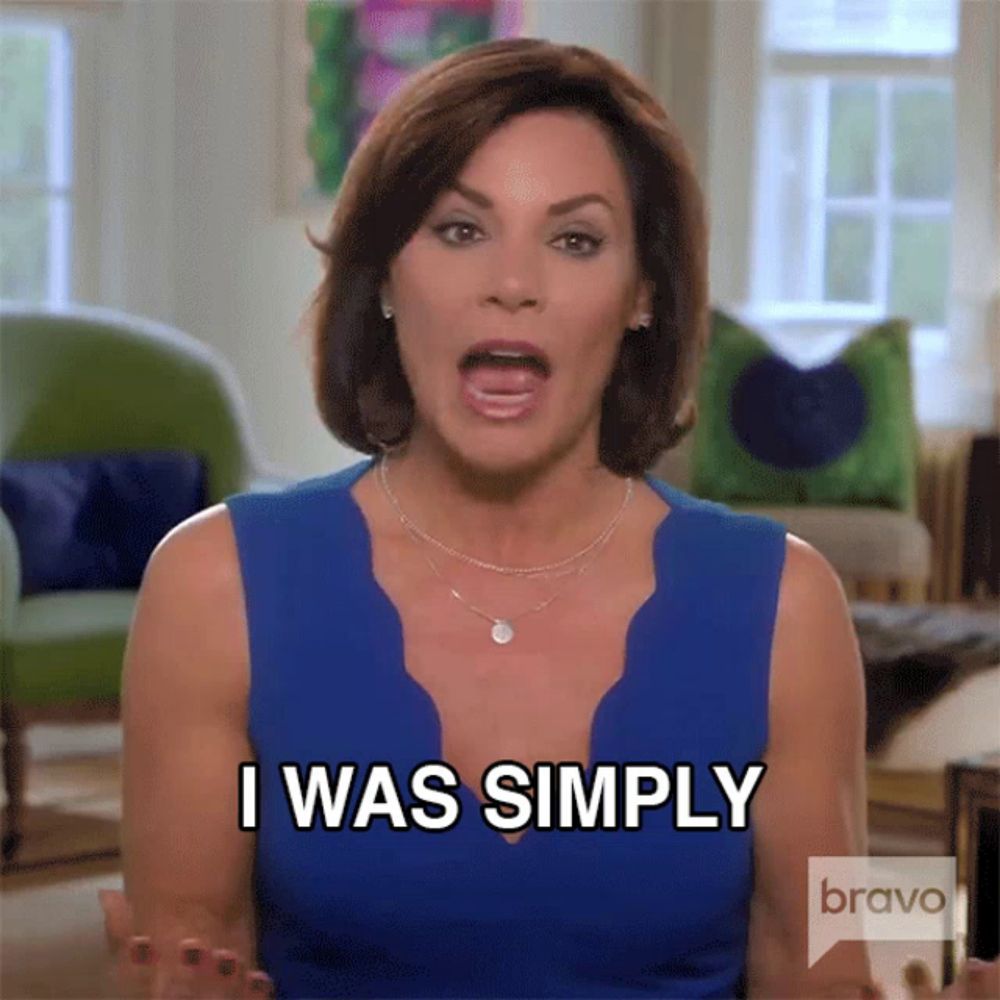 a woman in a blue dress is saying i was simply on bravo