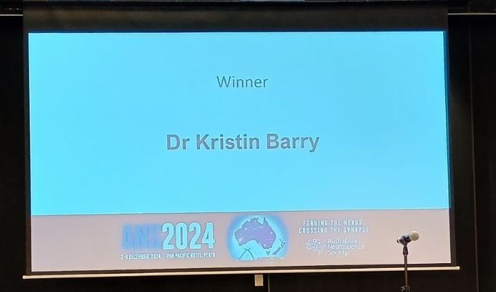 PowerPoint slide saying the winner of Ecr presentation group: Dr Kristin Barry 