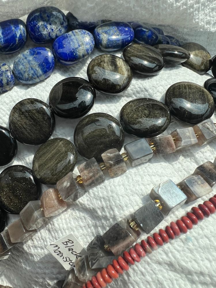 Irregular oval lapis lazuli, round golden obsidian, cube black moonstone, tiny red jasper discs