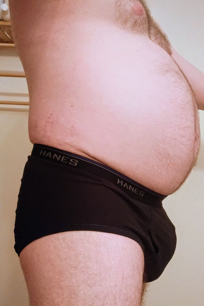A side view showing my bulge in black briefs