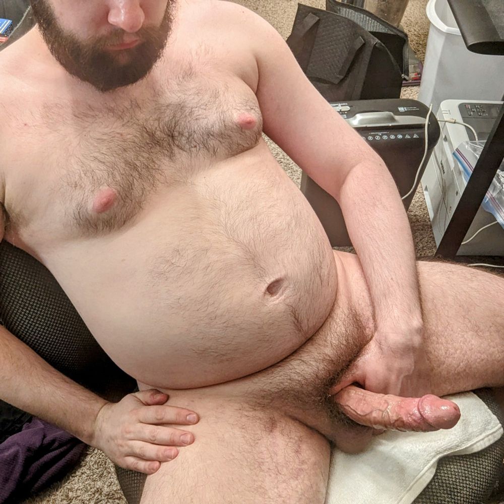 Sitting naked in an office chair with my dick rock hard