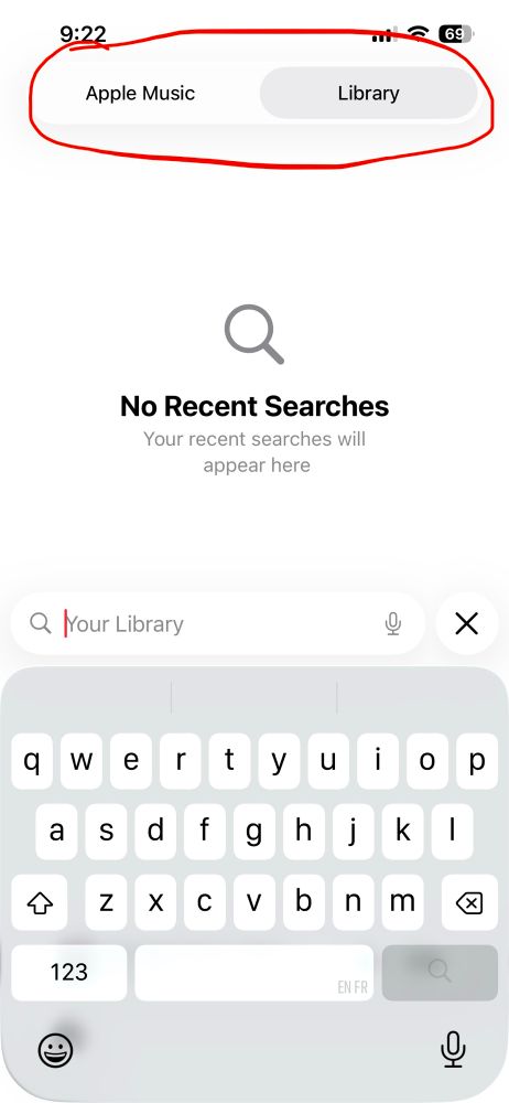A screenshot of the iOS Music app highlighting the segmented picker allowing users to search either Apple Music or their music library.