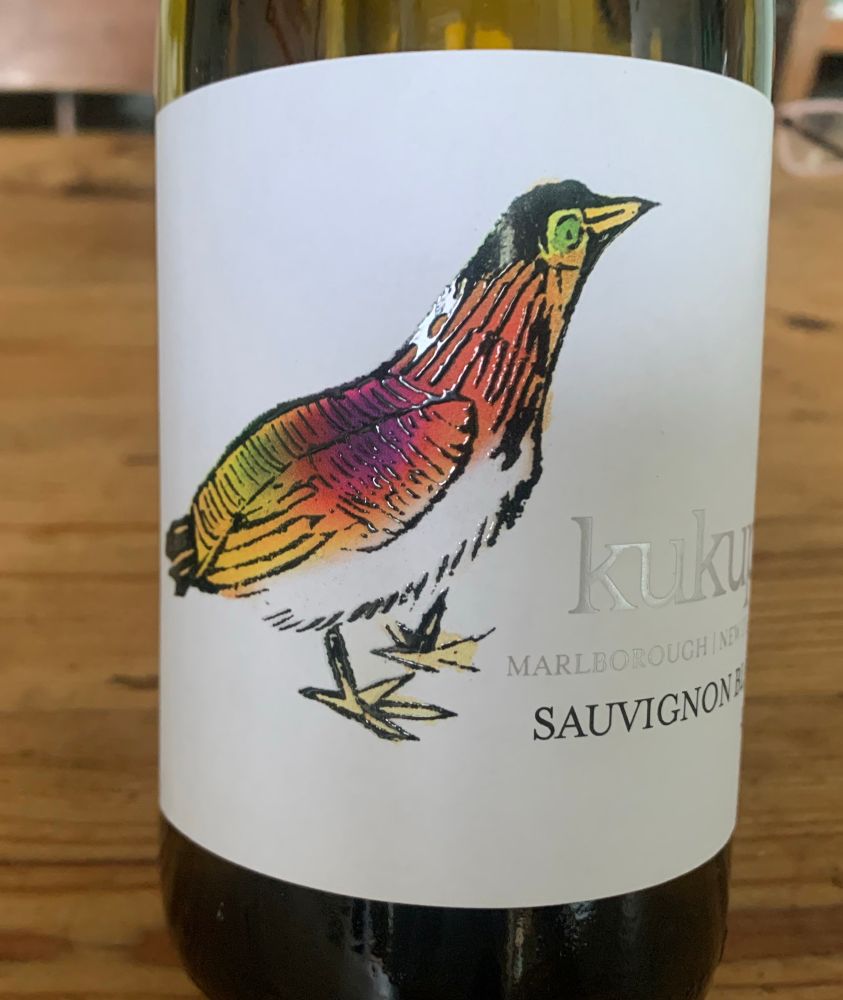 A bottle of wine with a colourful cartoon bird on the label.