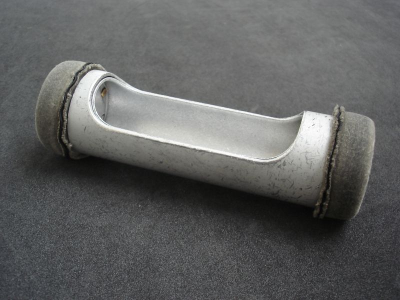 metal tube with central hole for holding cash, with rubber stoppers on each end, Reading Museum collection