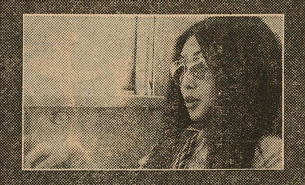 Newsprint photo of Meiko wearing sunglasses