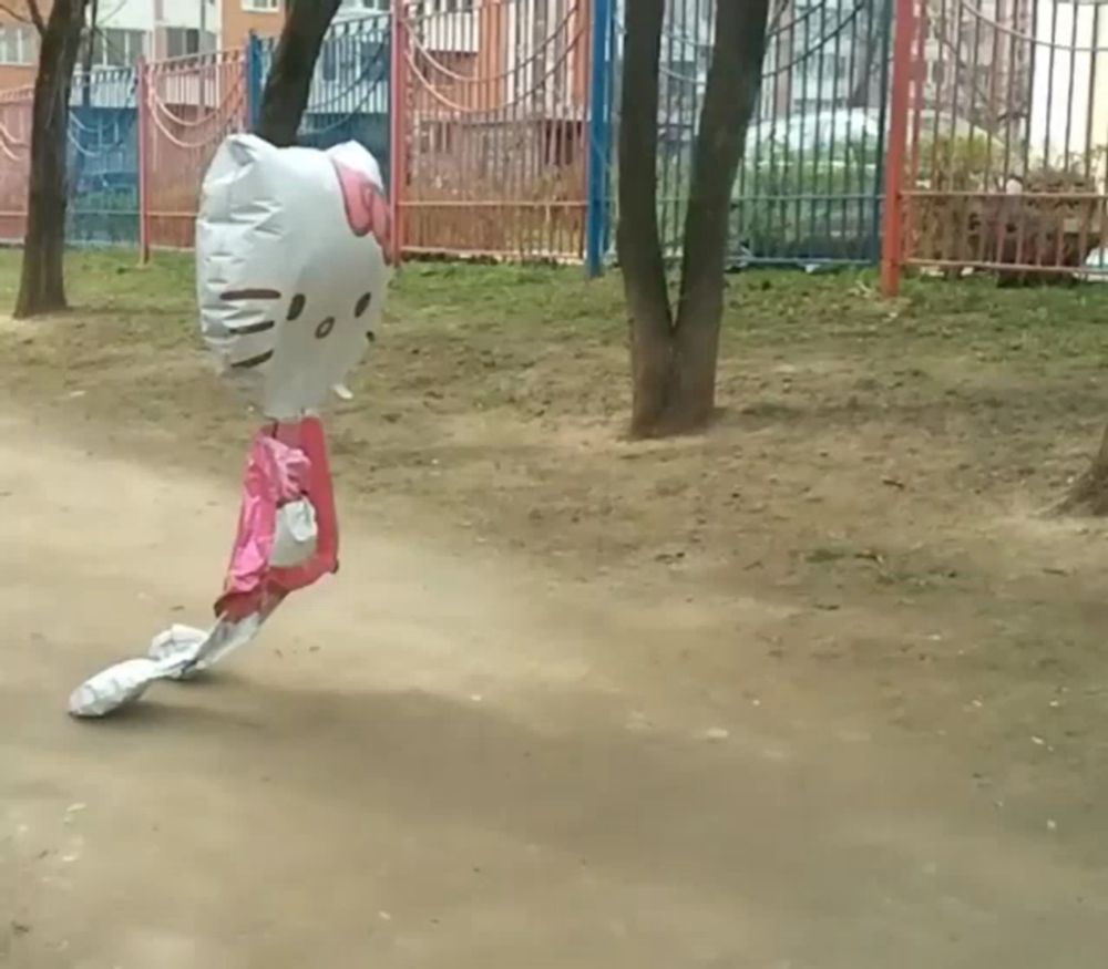 a hello kitty shaped balloon is flying through the air