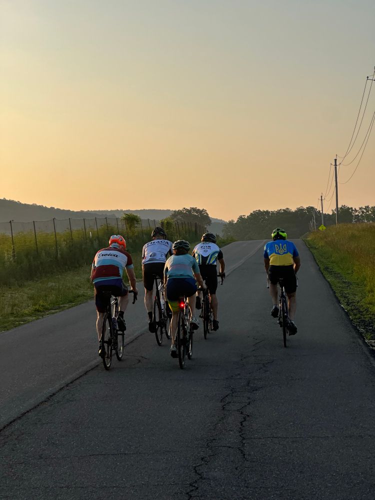 5 cyclists at dawn