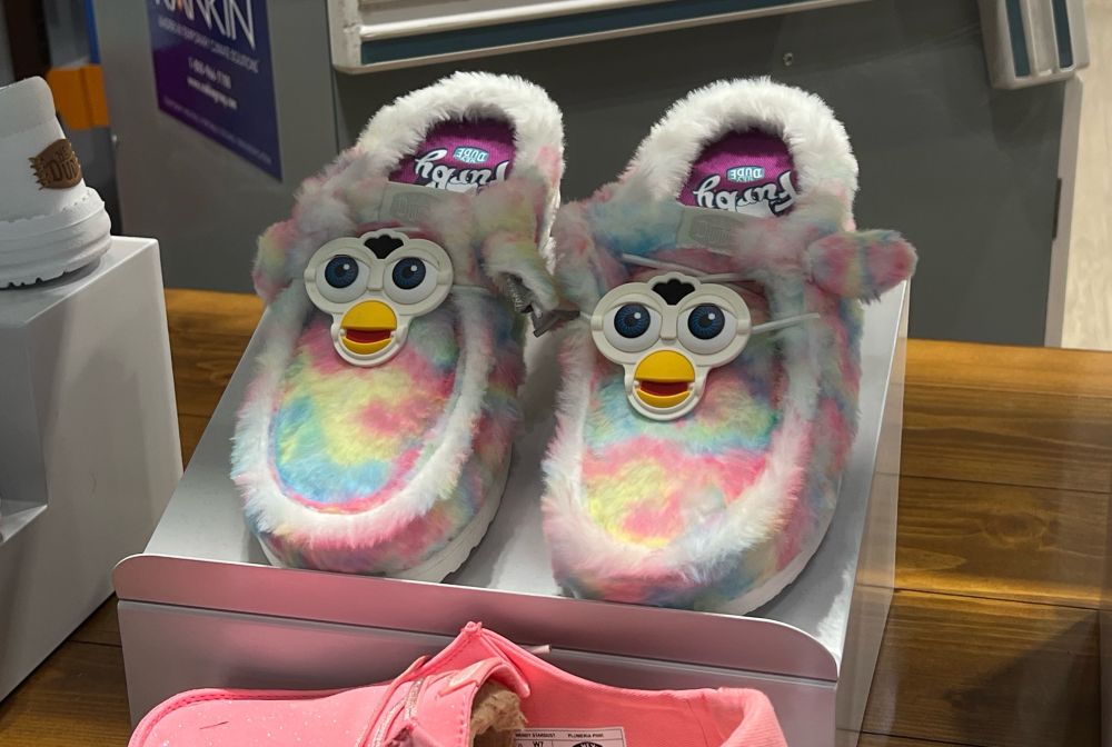 Furby themed crocs in a window display