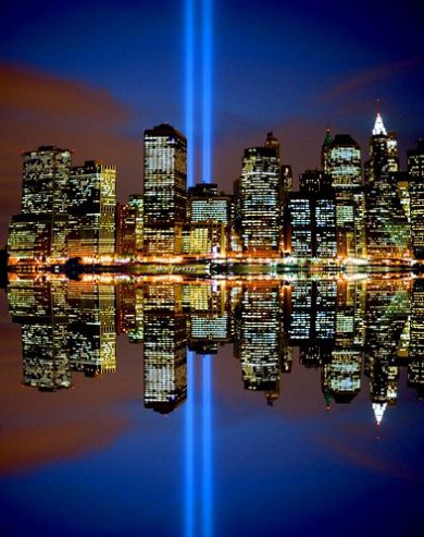 Sept 11 Tribute in Lights showing two light beams reflected in water and rising into the sky.