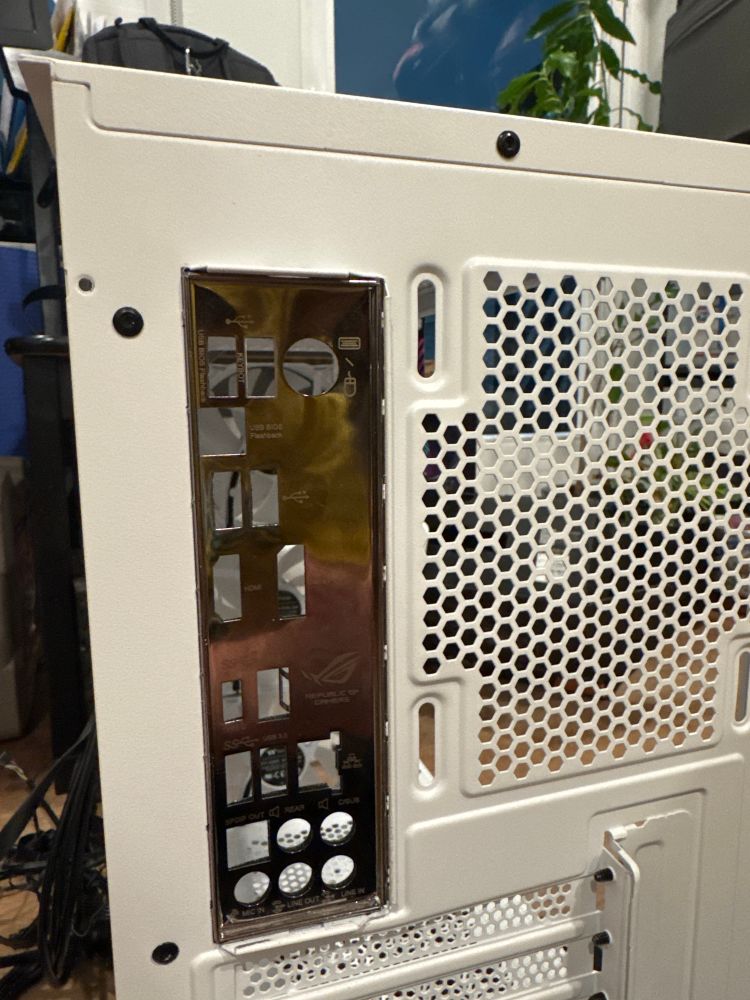 IO shield, almost in, but not staying put and flexing very hard. 