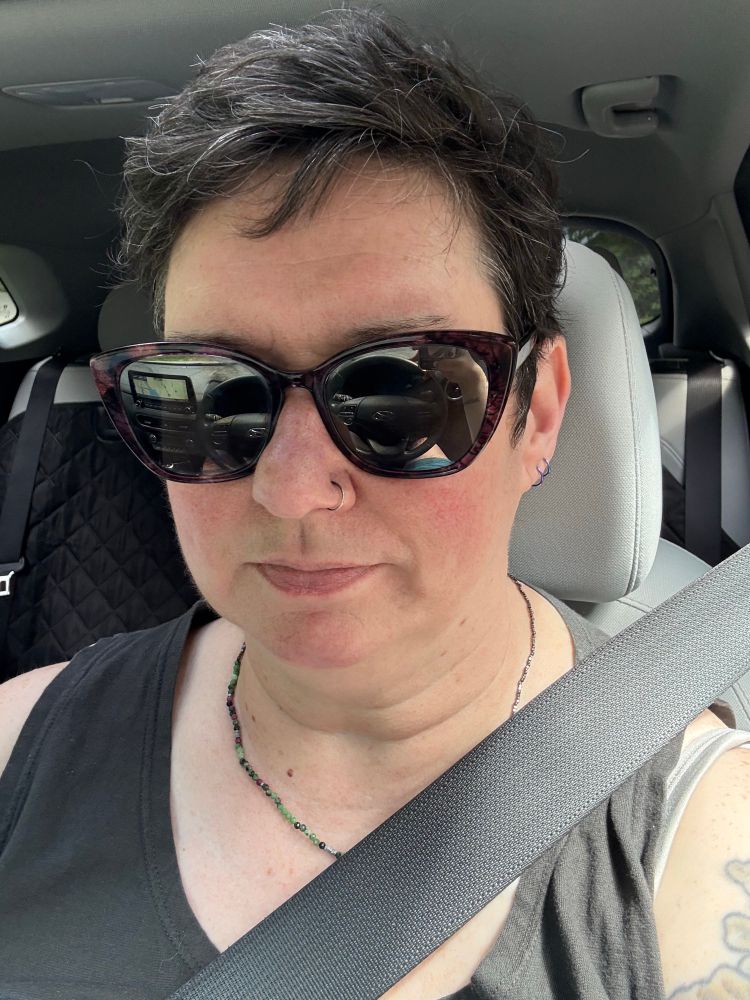 A selfie or a woman with short hair 