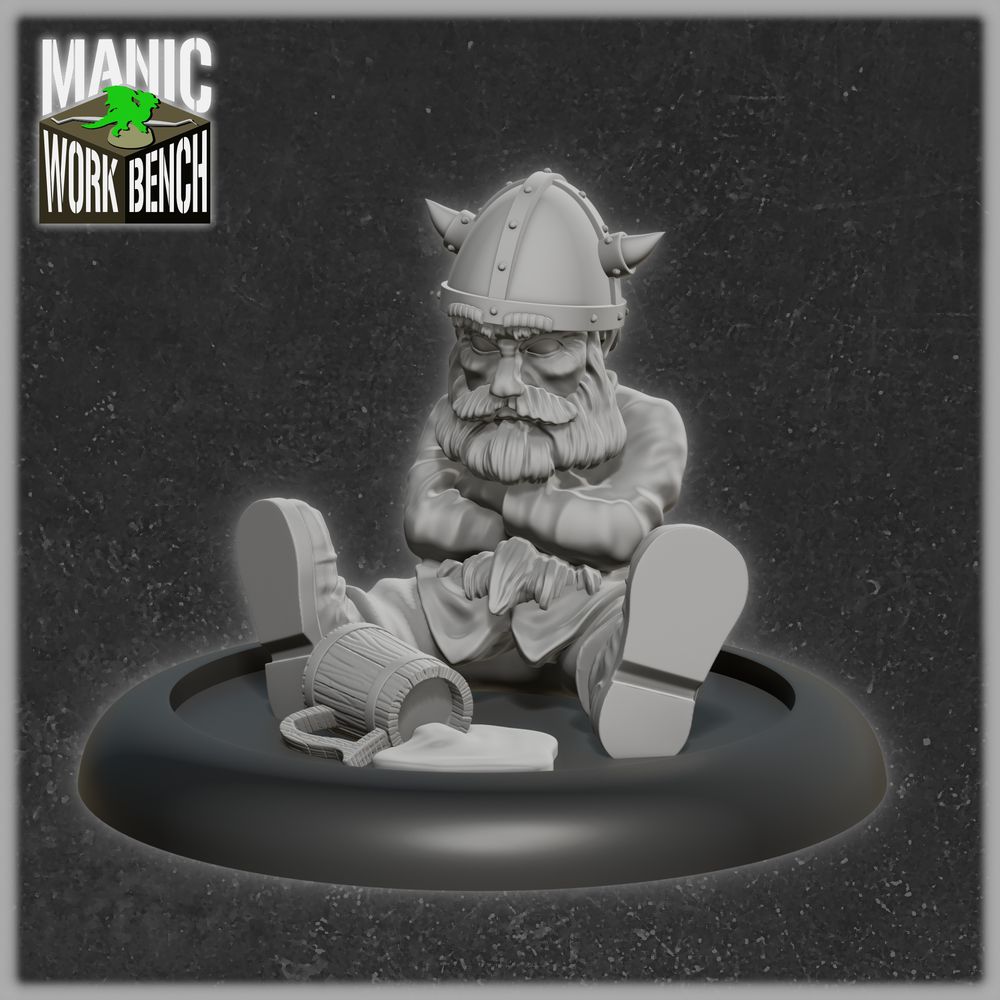 A grey render of a miniature depicting a dwarf sitting on the floor, his arms crossed as he angrily sulks over his spilled mug of beer.