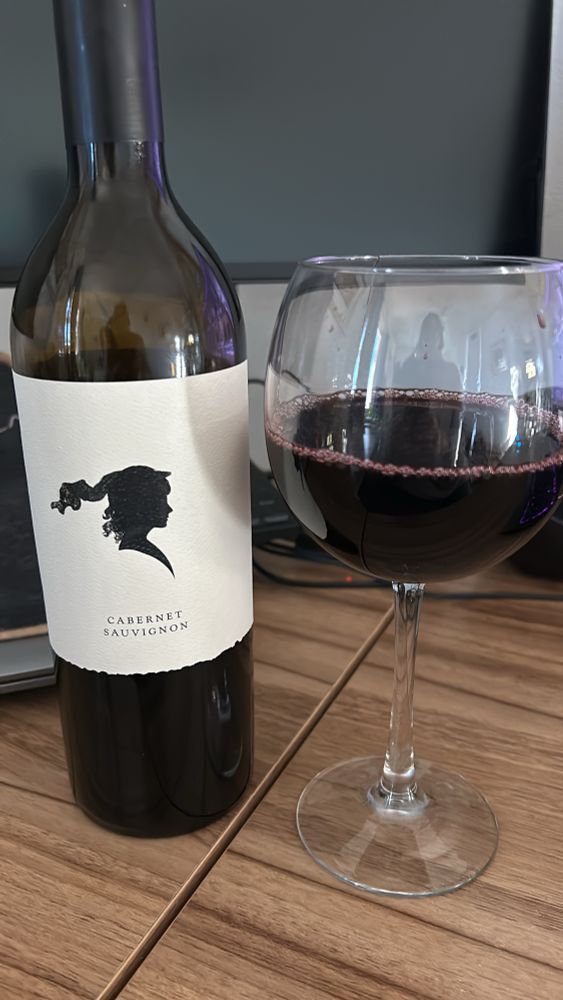 Wine bottle and glass, with wine