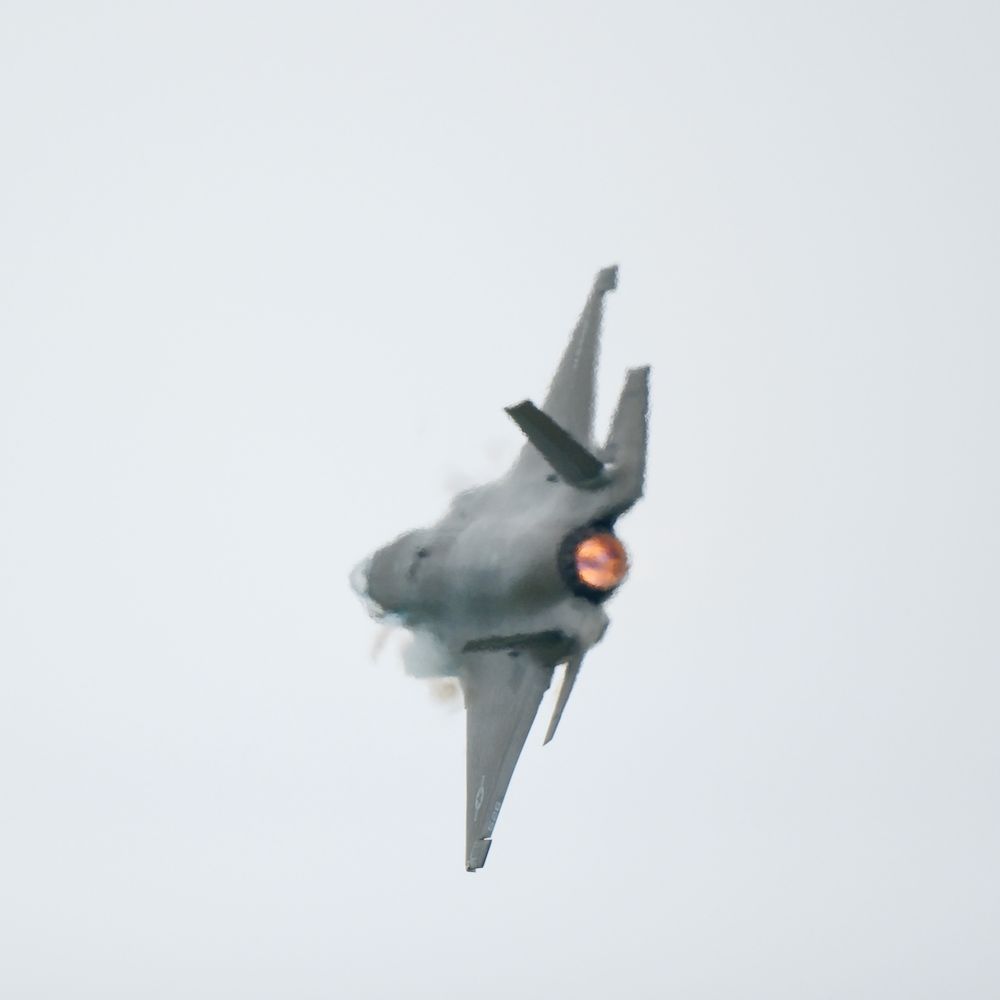 16x9 of an F-35 at the airshow.  View is of the afterburner with heat haze.