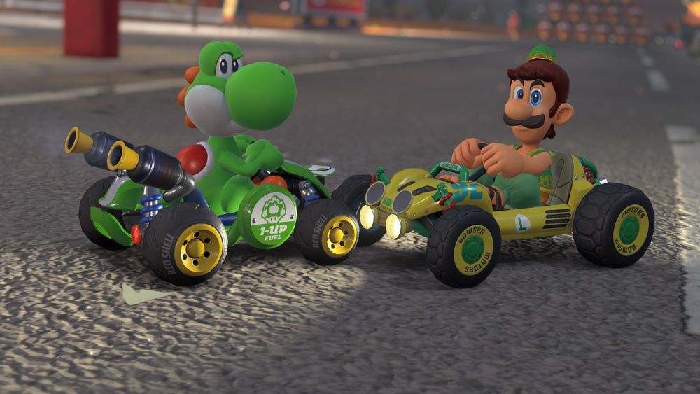 Screenshot from Mario Kart World. Yoshi and Luigi in their karts posed towards each other but looking at the camera with serious expressions.