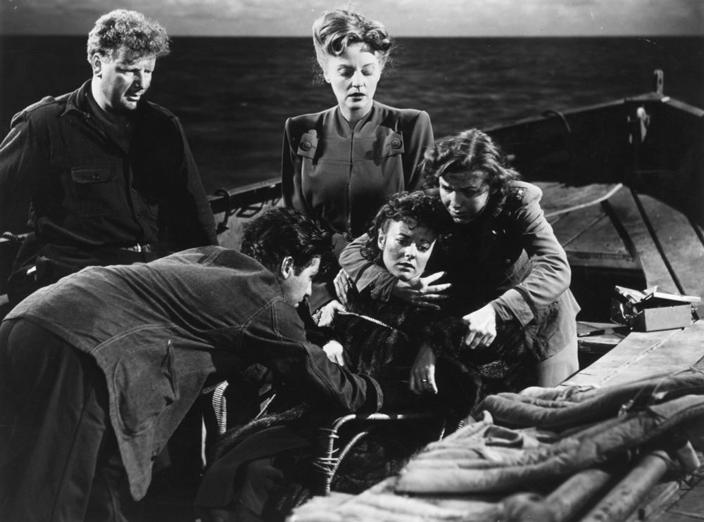 Sparks (Hume Cronyn) and Alice (Mary Anderson) tying up Mrs. Higley (Heather Angel) so she won't attempt to join her baby in death. Looking on are a bored Willi the Nazi (Walter Slezak) and Constance Porter (Tallulah Bankhead). 