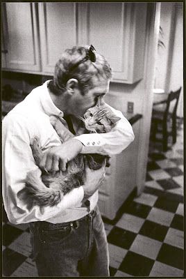 Tough guy Steve McQueen, still in his kitchen, putting his cheek up to his cat's head in a gesture of complete affection. Honestly I could look at this one all day. (b&w)