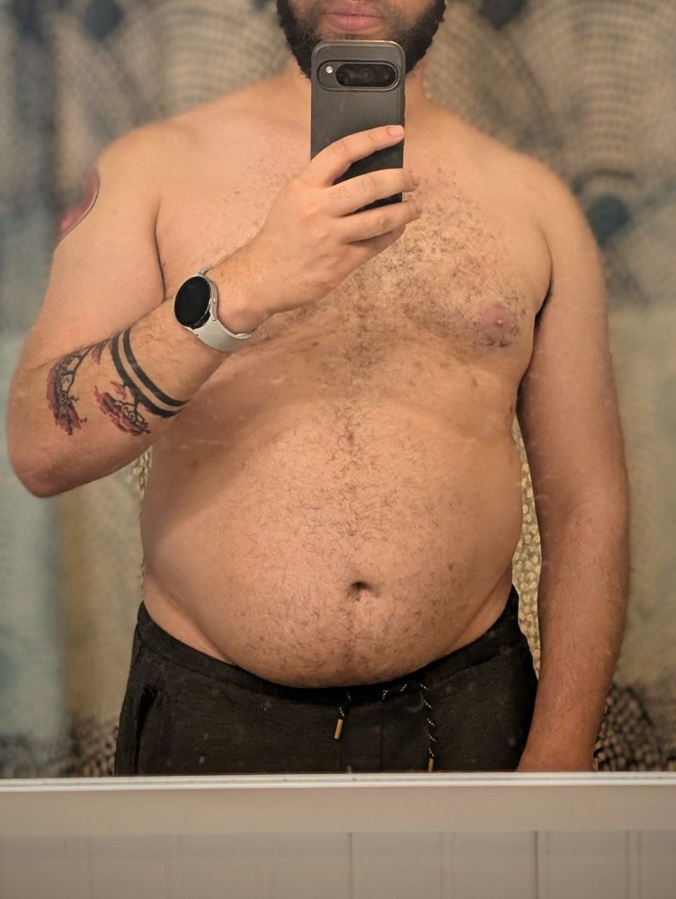 Me looking at my fitness progress in the mirror