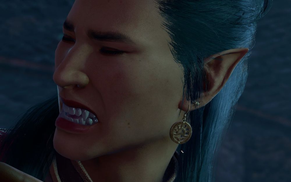 Dorian grimaces, offering the audience a clear view of his fangs.
