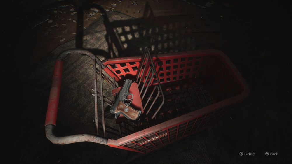 The gun in the shopping cart in Silent Hill 2 Remake. The store's logo is visible on the side.