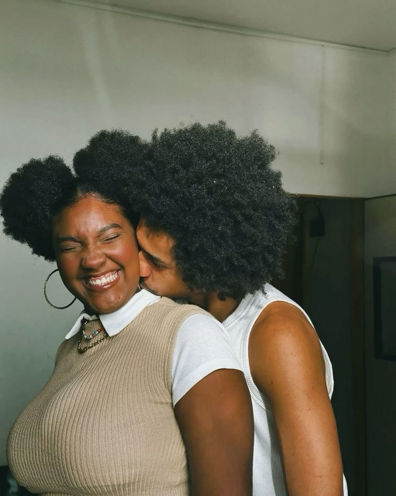 Black couple being intimate and having fun.