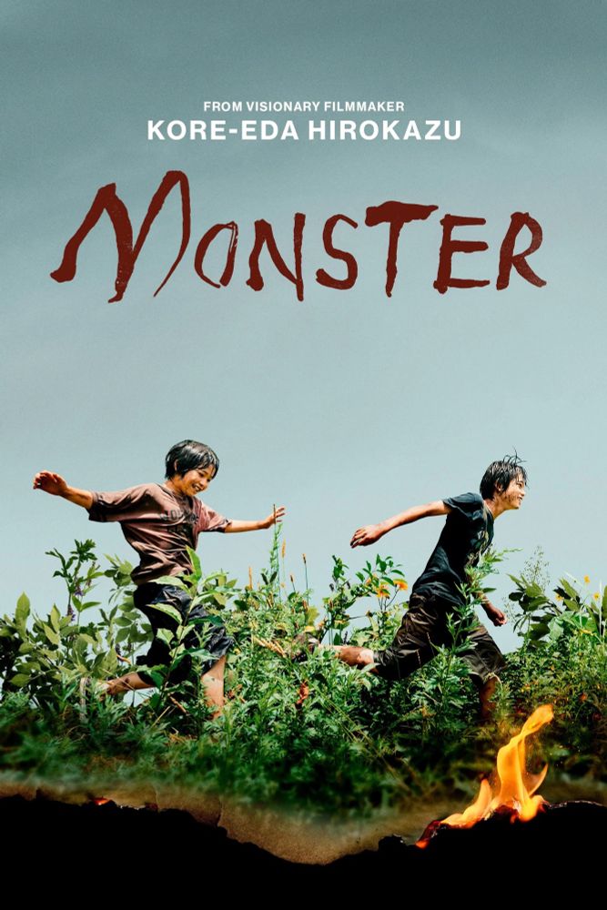 poster for Monster, the film by hirokazu kore-eda. two boys running in brush, while a small flame slowly consumes the image. 