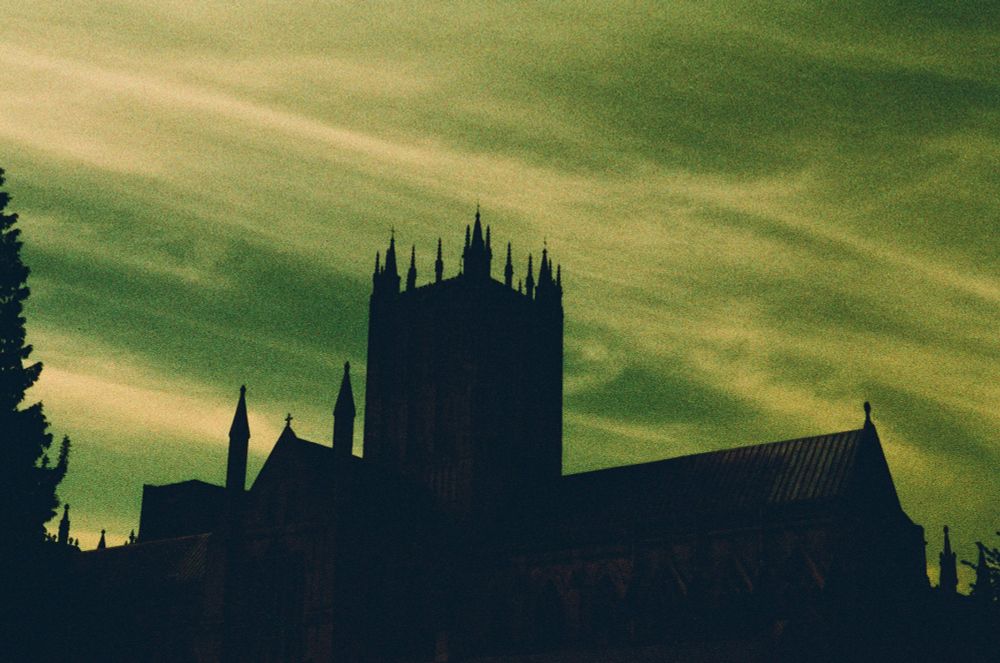 A cathedral that, through using a unique type of film, appears to be shrouded in a green sky. 