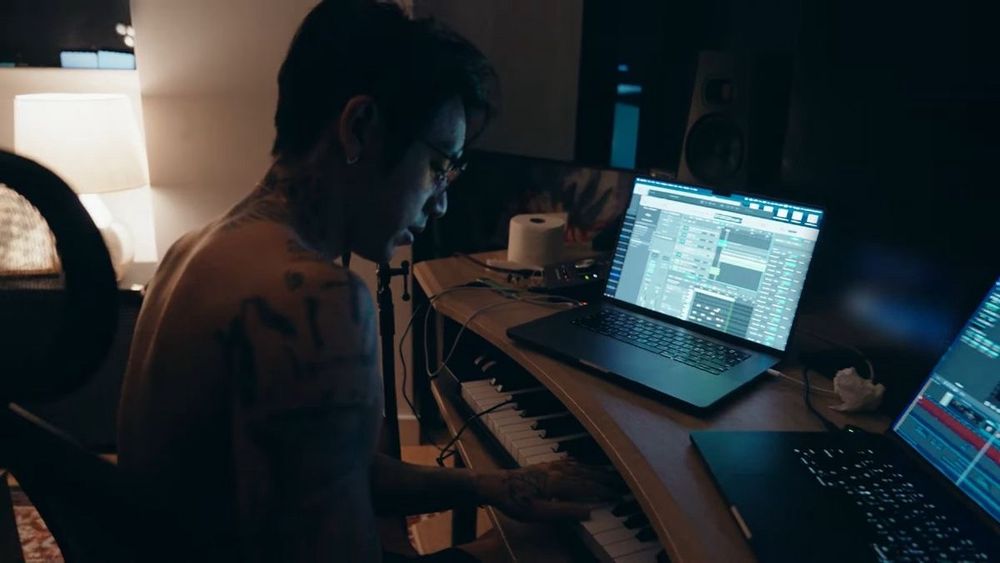 photo of dpr ian making music/editing a video in his home studio