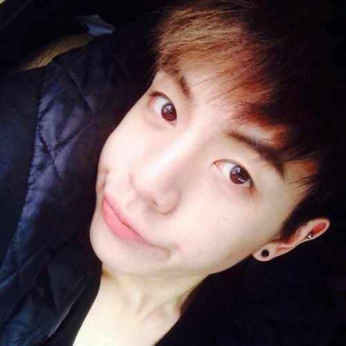 selfie of a young dpr ian smiling in a sassy/silly way, probably around 2014-2016