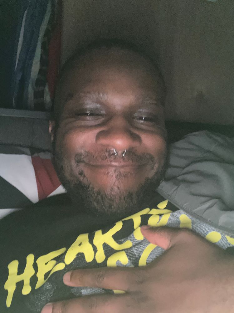 Decided to smile for some reason lol. But just me in bed with my Dollar Signs shirt if their album Hearts of Gold