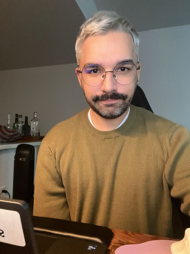 Taking a selfie with booze bottles in the background. Lol