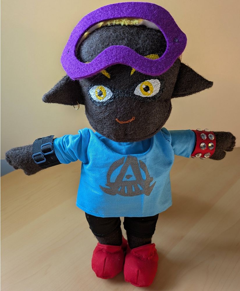 A handmade plushie of a male Inkling made from various fabrics. A lot of love and care went into making him.