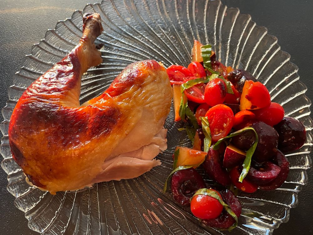 Cast iron cooking experiment (8/3/25): Buttermilk-brined roast chicken served with a spicy summer stone fruit salad.