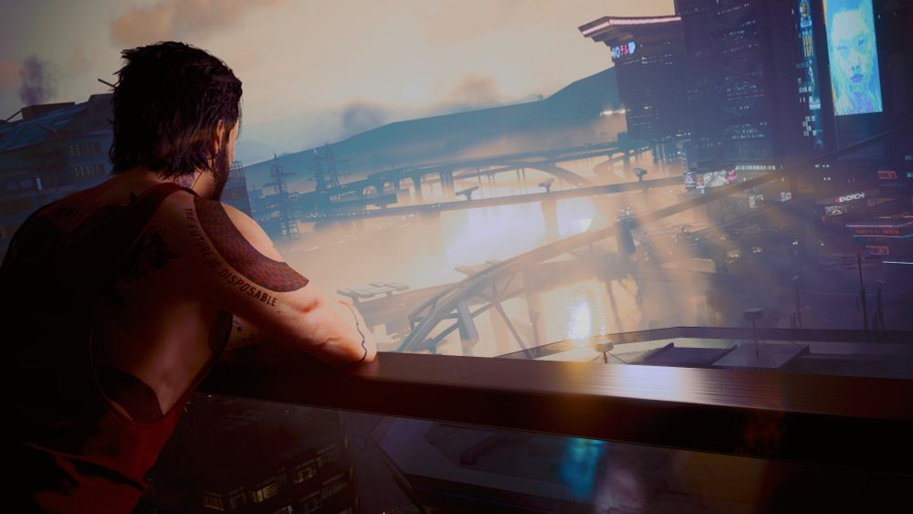My Cyberpunk 2077 V leaning over a balcony watching the sun rise with the city in the background.