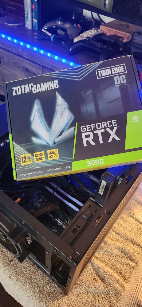 Zotac GeForce RTX 3060 box sitting on an open desktop computer tower.