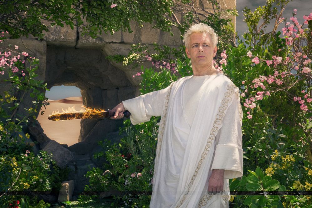 Aziraphale showing the way out from Eden to the humans. He's pointing his flaming sword to a kind of hole in the wall? Idk, that doesn't look like a gate, does it? Shouldn't it be a gate?