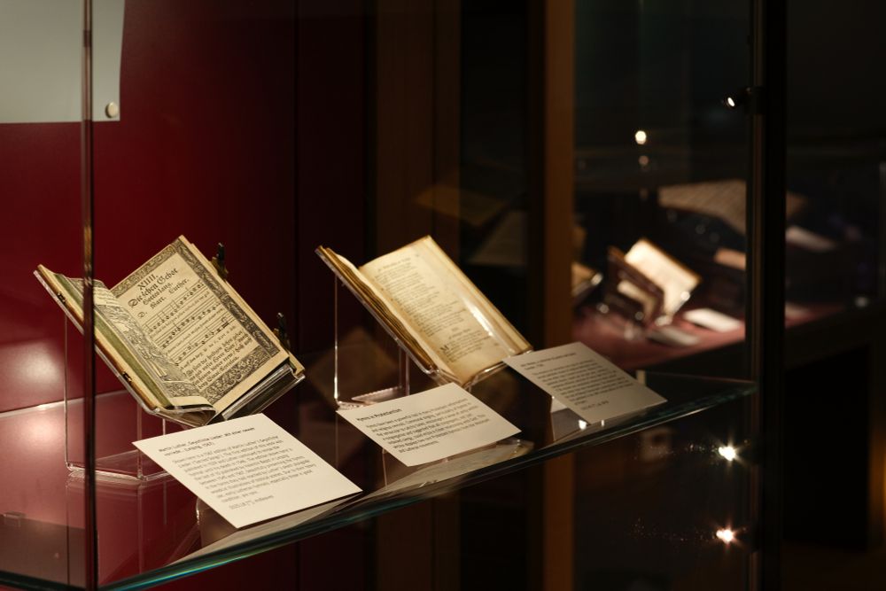 Image of exhibition case and contents for the 'Sing Joyfully' exhibition.