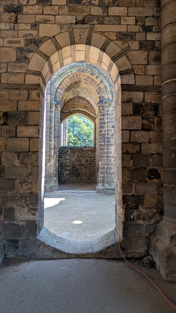 A view through an arched doorway in the church