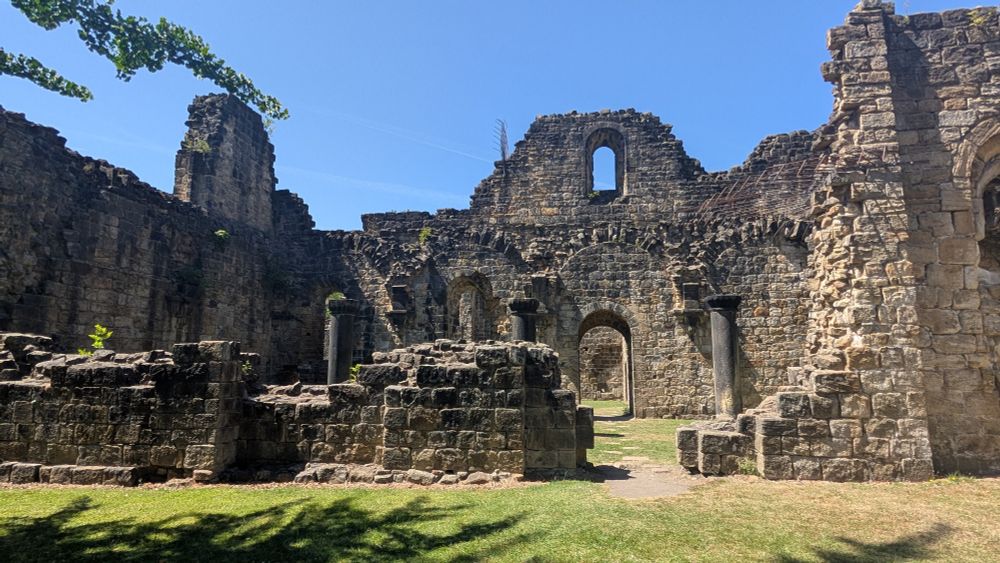Another view of the ruins, showing some walls, doors, windows and pillars open to the sky.