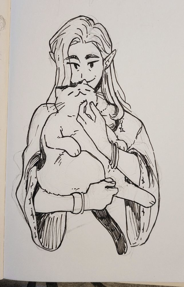 Photo of a fineliner drawing from my sketchbook of my OC Fabian holding his fat cat Bonaparte, or Bonnie for short. Fabian wears his long hair open and wears a cardigan with wide sleeves. He's scratching Bonnies chin who enjoys it a lot.