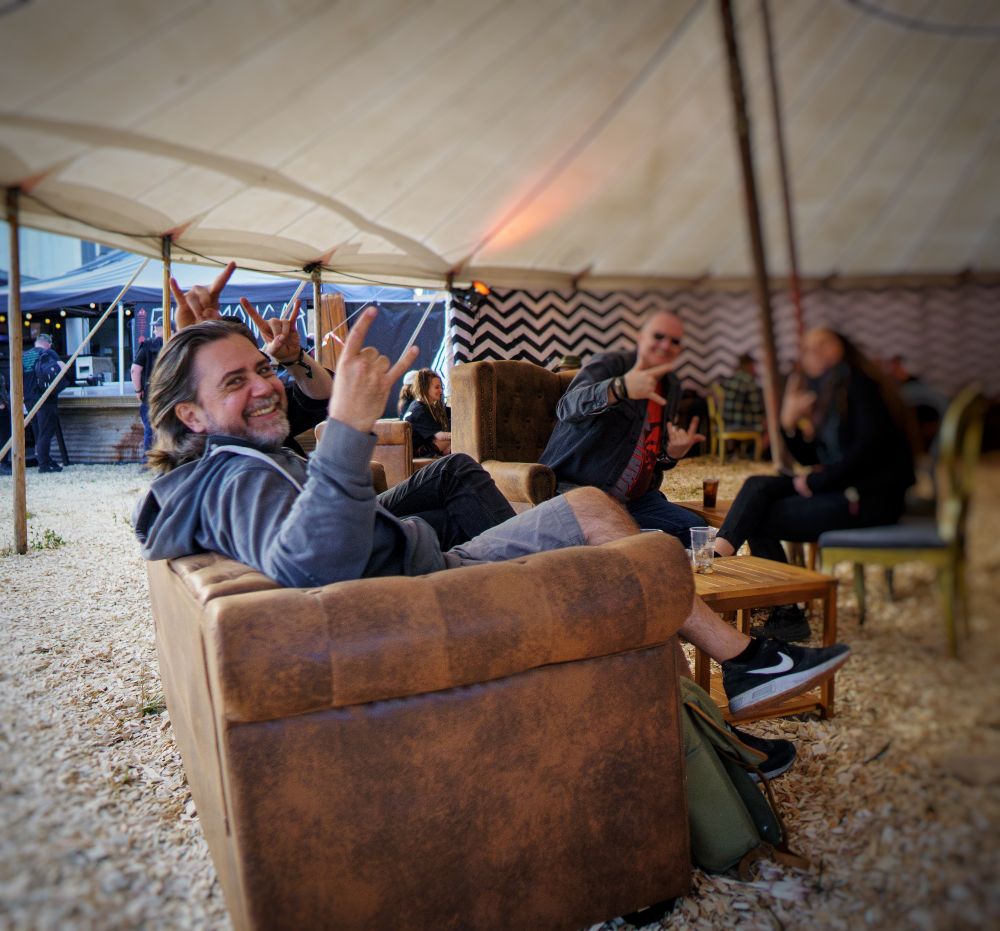 Casper sitting in a sofa during the Copenhell festival. 