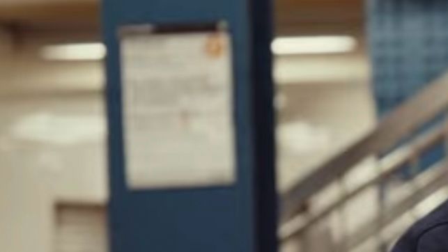 Zoomed in screenshot of a service bulletin poster in the background of the stock video