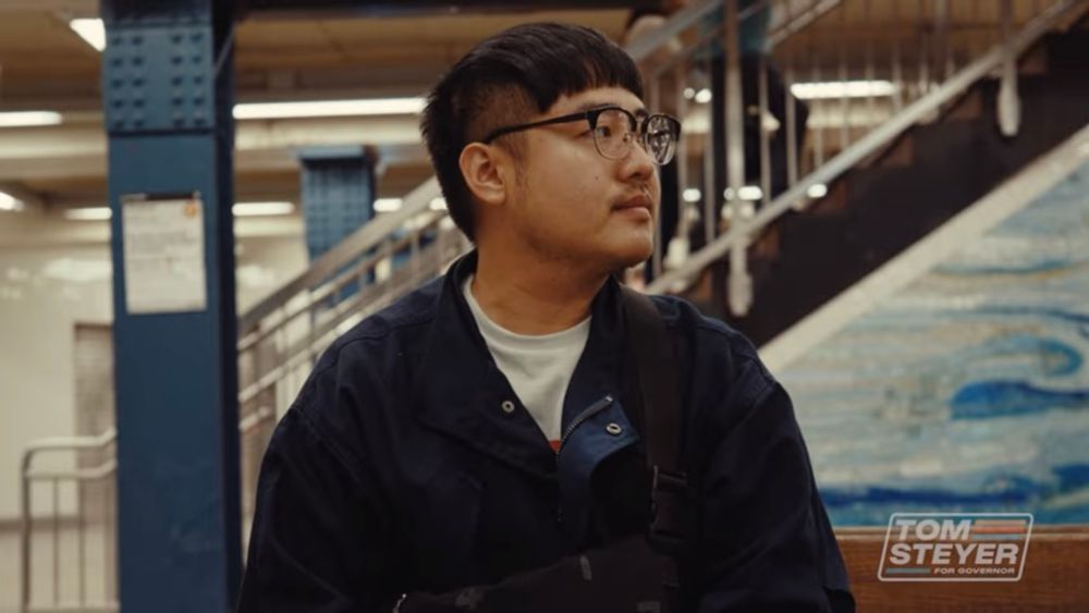 Screenshot from Tom Steyer’s California gubernatorial bid launch video showing a man from a stock video standing on a train platform 