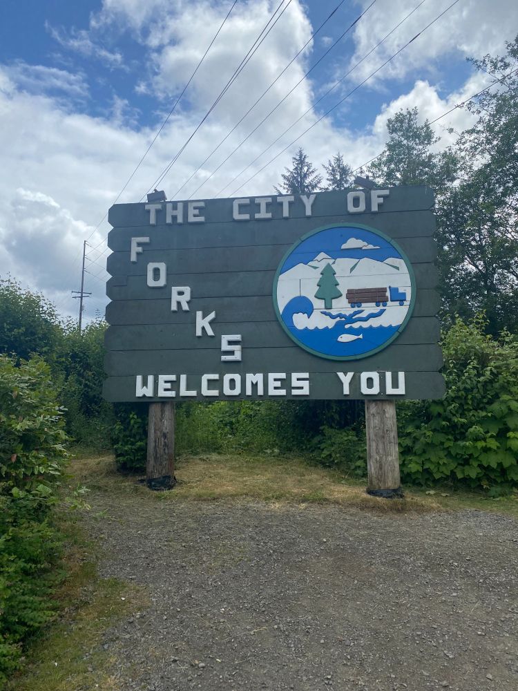 "The City of Forks Welcomes You."  With an emblem with a tree and water and mountain.  My daughter was excited for the Forks pictures because of Twilight.  Then I get  a text:  "I just found out it wasn't even filmed in Forks."   