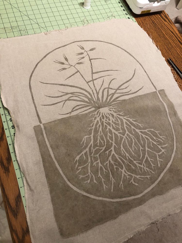 An image of California oat grass painted onto linen and dyed with spent espresso grounds