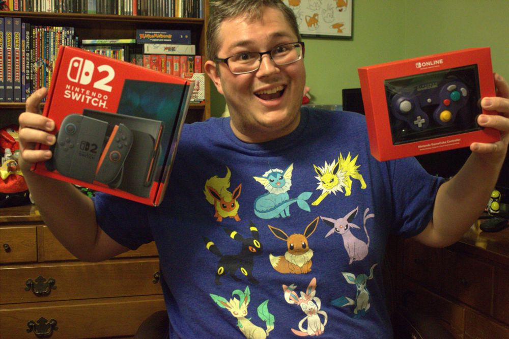 A photo of me holding the Switch 2 and the NSO GameCube controller. Expect a lot of dumb self portraits of myself here. 😅